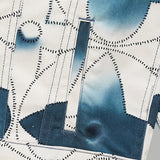 Close-up detail shot of Louis Vuitton luxury clothing with signature branding