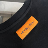 Close-up detail shot of Louis Vuitton luxury clothing with tailored silhouette