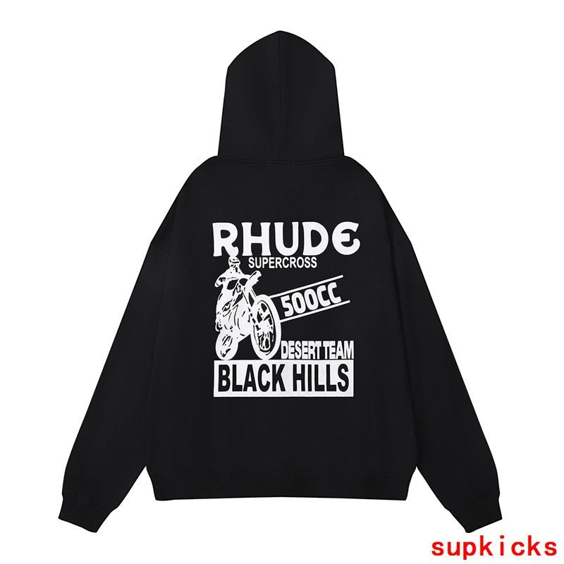 Flat lay presentation of Rhude luxury clothing with signature branding