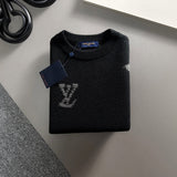 Side profile of Louis Vuitton luxury clothing with signature branding