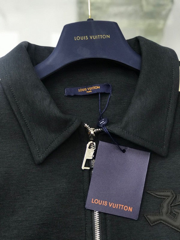 Flat lay presentation of Louis Vuitton luxury clothing with tailored silhouette