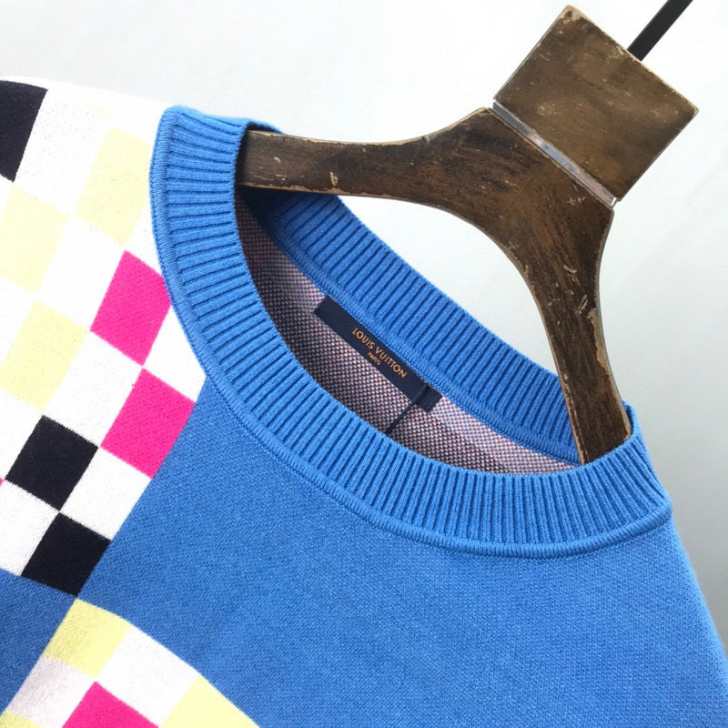 Close-up detail shot of Louis Vuitton luxury clothing with logo-detail design