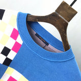 Close-up detail shot of Louis Vuitton luxury clothing with logo-detail design