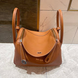 Side view of sleek structured handbag