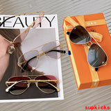 Close-up detail view of Louis Vuitton unisex sunglasses