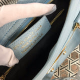 Side profile of chic everyday-luxe women's handbag – women's statement bag