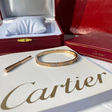 Close-up detail view of Cartier unisex jewelry piece