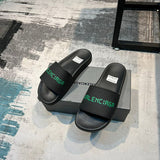 Balenciaga Black Flat Thong Sandals - Close-Up Texture View