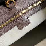 Side profile of signature statement women's handbag – women's luxury handbag
