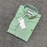 Side profile of Lacoste luxury clothing with monogram-inspired silhouette