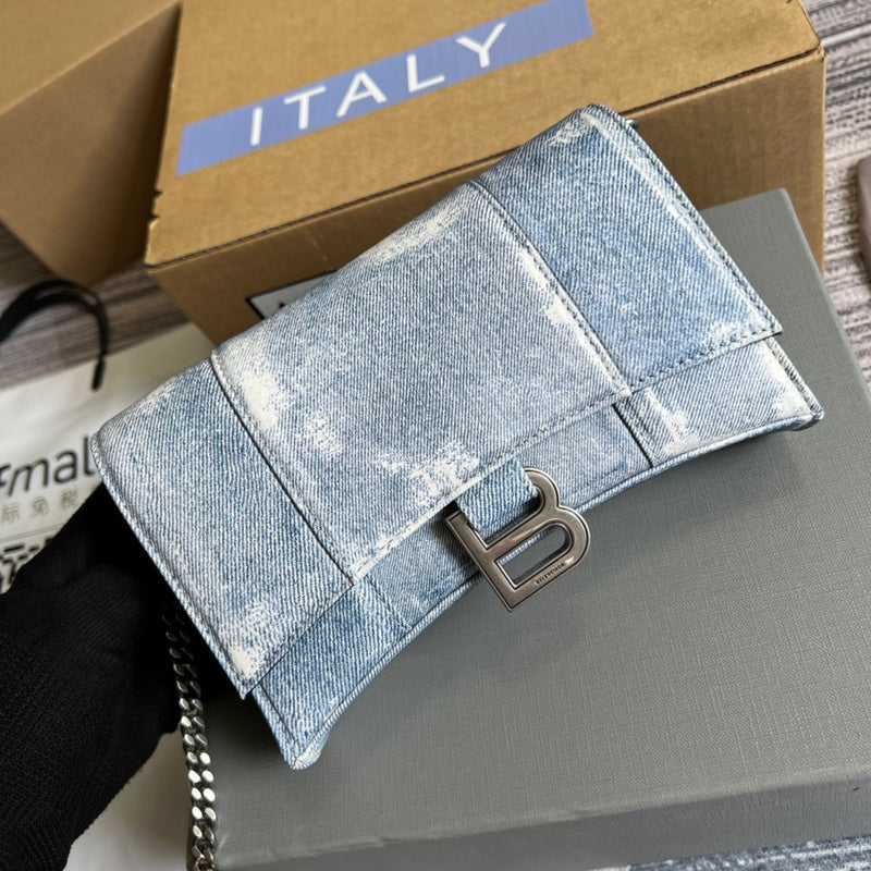 Styled lifestyle shot of modern refined women's handbag – women's luxury handbag
