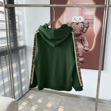 Close-up detail shot of Gucci luxury clothing with logo-detail design