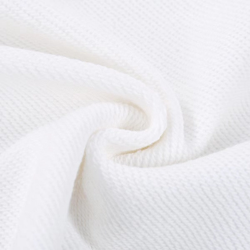 Close-up detail shot of Louis Vuitton luxury clothing with signature branding