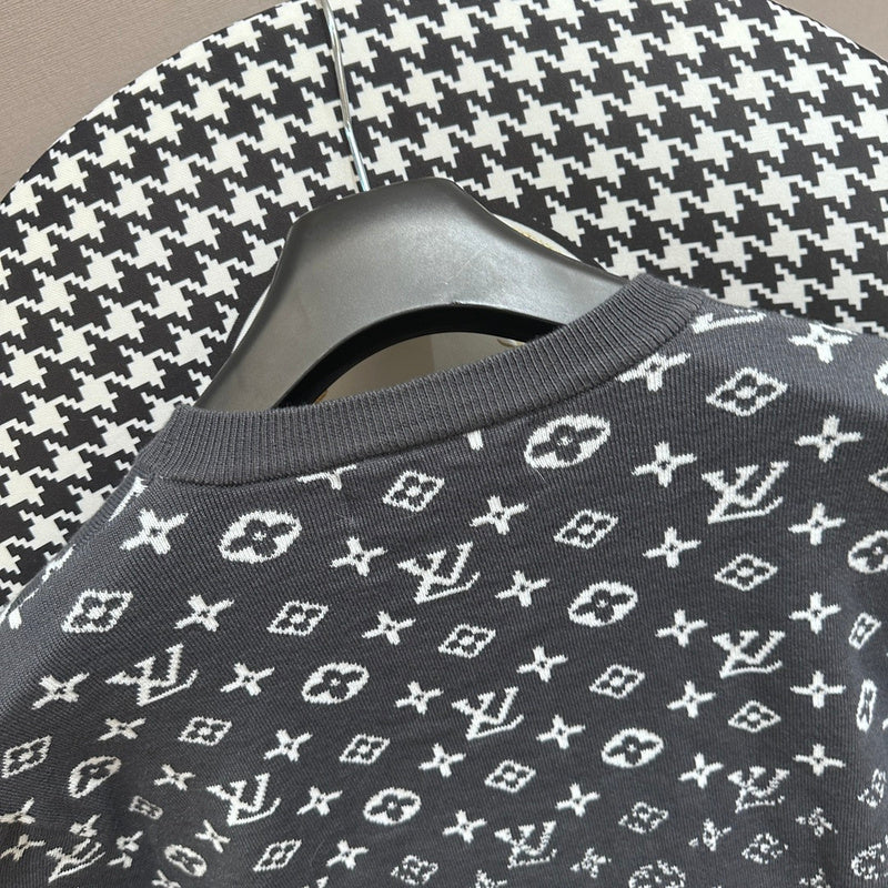 Full styled look of Louis Vuitton luxury clothing with label-forward styling