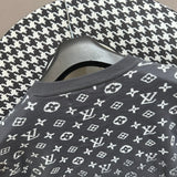 Full styled look of Louis Vuitton luxury clothing with label-forward styling