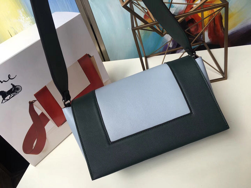 Styled lifestyle shot of classic signature women's handbag – women's luxury handbag