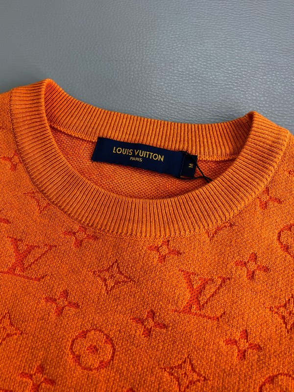 Flat lay presentation of Louis Vuitton luxury clothing with monogram-inspired silhouette