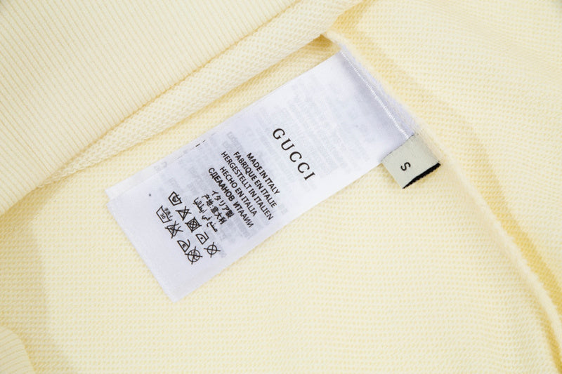 Close-up detail shot of Gucci luxury clothing with tailored silhouette