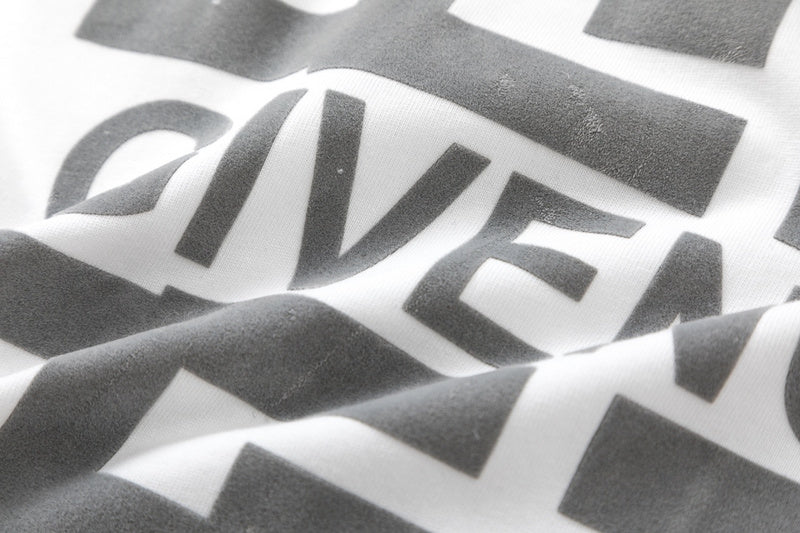 Flat lay presentation of Givenchy luxury clothing with signature branding