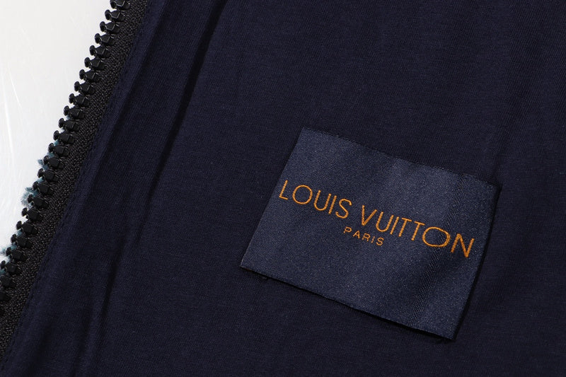 Flat lay presentation of Louis Vuitton luxury clothing with label-forward styling