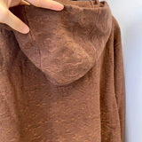 Close-up detail shot of Louis Vuitton luxury clothing with streetwear-inspired cut