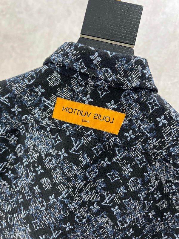 Close-up detail shot of Louis Vuitton luxury clothing with label-forward styling