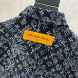 Close-up detail shot of Louis Vuitton luxury clothing with label-forward styling