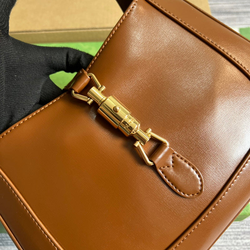 Handle and strap detail of polished sleek women's handbag – women's designer-style accessory