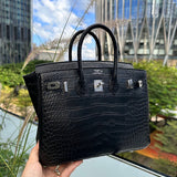 Side view of sculpted structured handbag