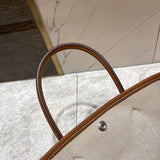 Side view of refined structured handbag