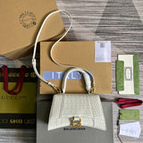 Front view of classic structured women's handbag – women's designer-style accessory