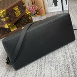 Styled lifestyle shot of refined signature women's handbag – women's designer-style accessory