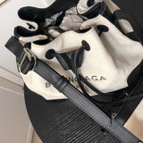 Styled lifestyle shot of statement structured women's handbag – women's luxury accessory