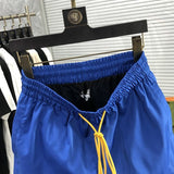 Side profile of Rhude luxury clothing with streetwear-inspired cut