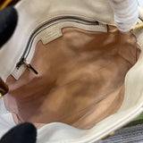 Side profile of structured statement women's handbag – women's luxury handbag