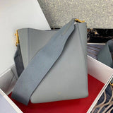 Side profile of elevated signature women's handbag – women's luxury handbag