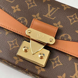 Handle and strap detail of sleek signature women's handbag – women's luxury accessory
