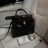 Side view of sleek structured handbag