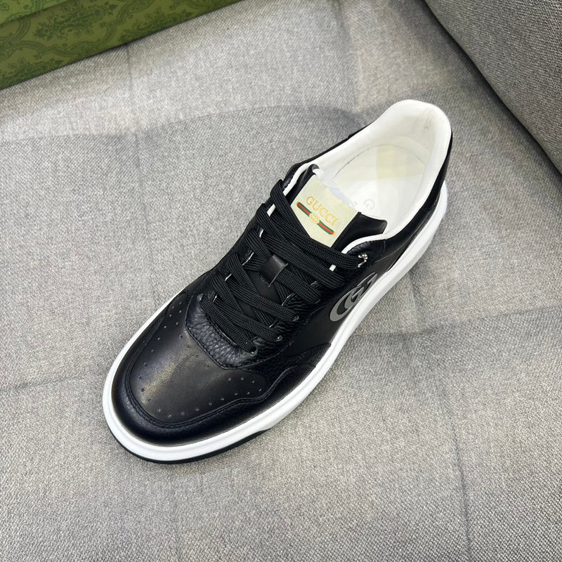 Side profile of Gucci neutral cream sneakers signature lace-up style