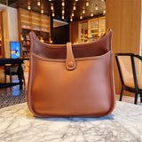  Streamlined top-handle bag carried on shoulder