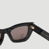 Close-up of Bottega Veneta sunglasses hardware and fine stitching