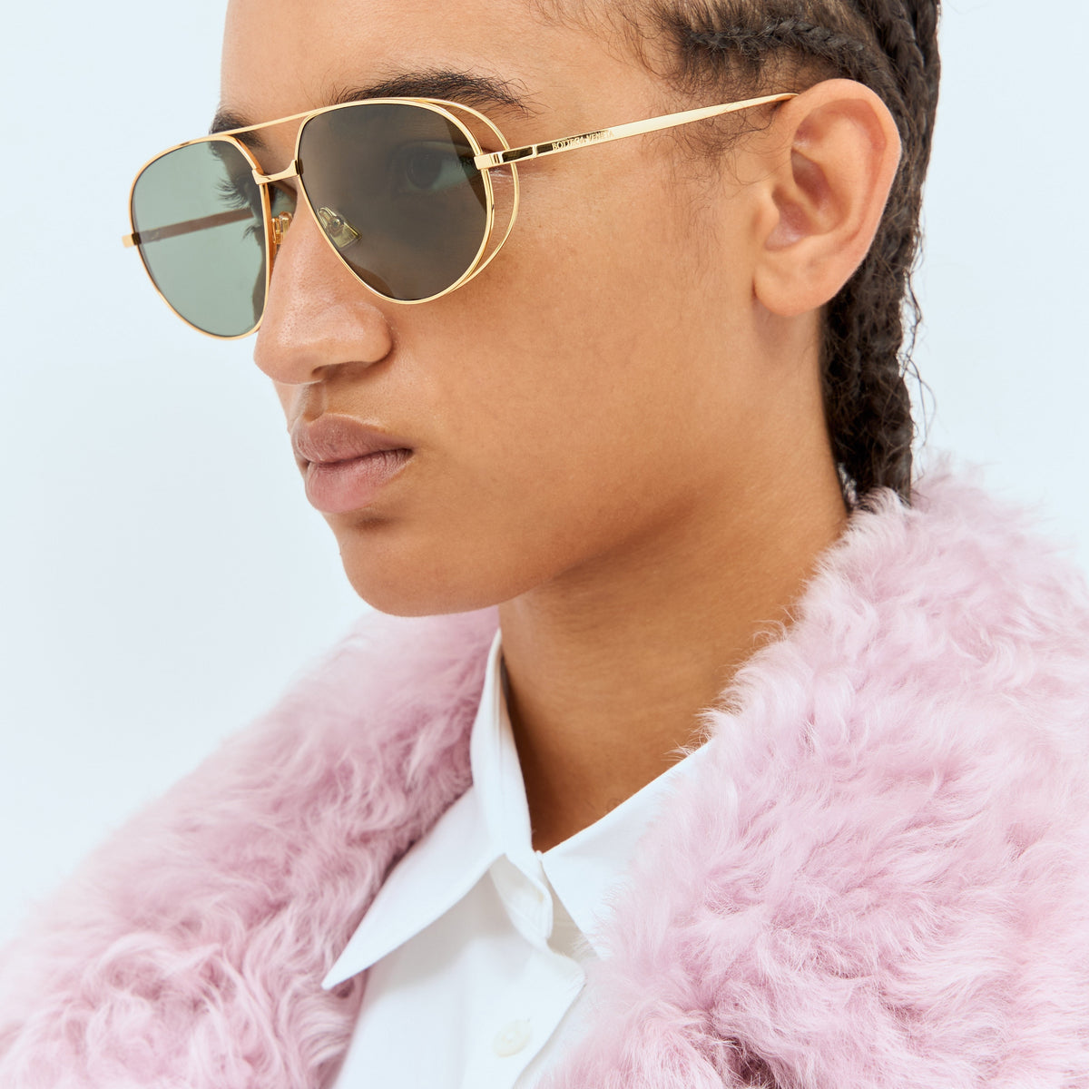 Close-up of Bottega Veneta sunglasses hardware and fine stitching