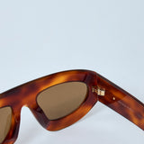 Bottega Veneta sunglasses lifestyle shot premium designer piece