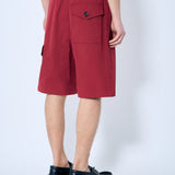 Close-up of Bottega Veneta pants hardware and fine stitching