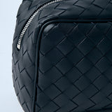 Close-up of Bottega Veneta cross body bags hardware and fine stitching
