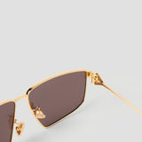 Close-up of Bottega Veneta sunglasses hardware and fine stitching