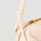 Close-up of Bottega Veneta shoulder bags hardware and fine stitching