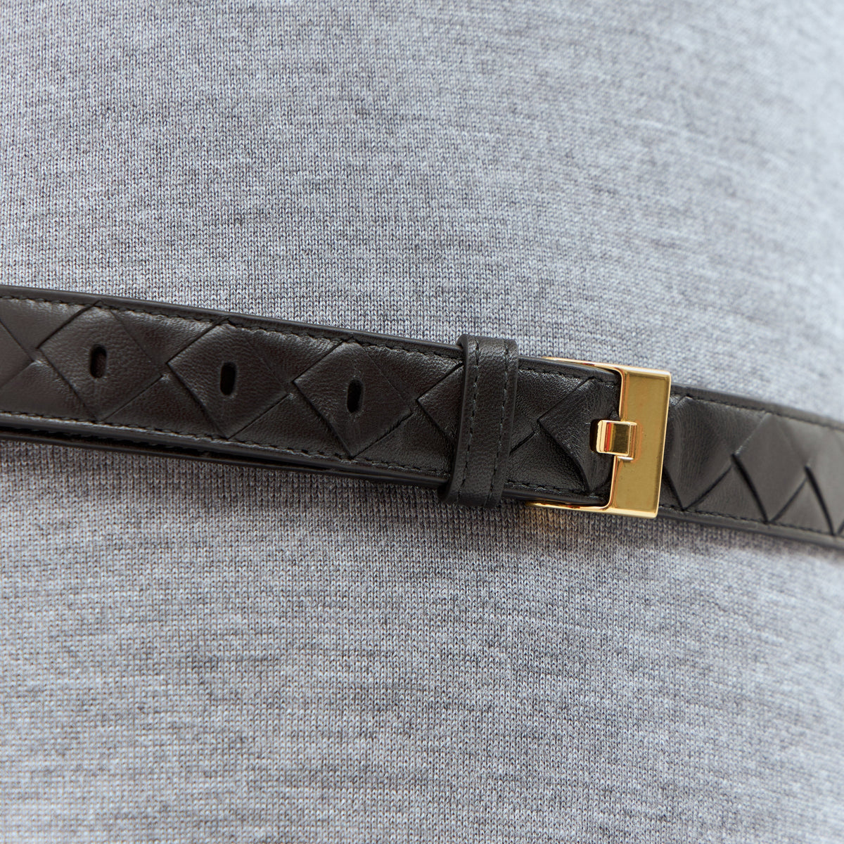 Close-up of Bottega Veneta belts hardware and fine stitching