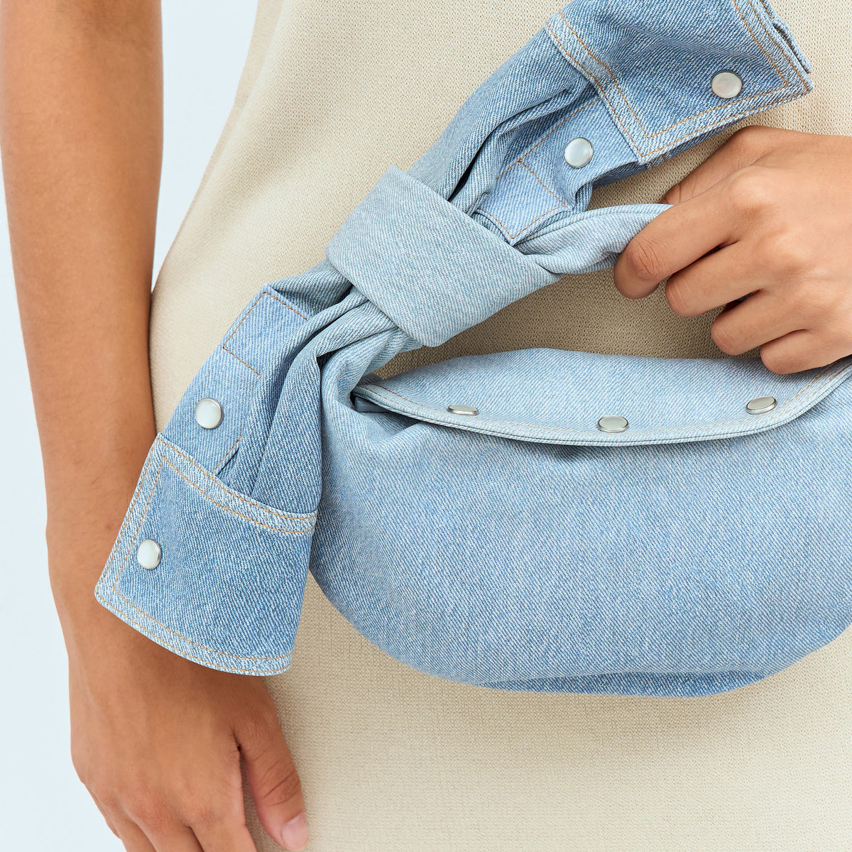 Close-up of Bottega Veneta shoulder bags hardware and fine stitching