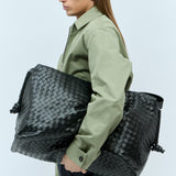 Close-up of Bottega Veneta weekend/travel bags hardware and fine stitching